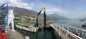 Katja Boat Locarno. Infissione di 2 pali di fondazione (15 m x 60 cm) per pontile di attracco, Lago Maggiore, Ticino.
